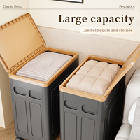 Boîte de rangement pliable moderne en polypropylène écologique avec couvercle et roulettes, utilisée pour organiser les vêtements et les couvertures
