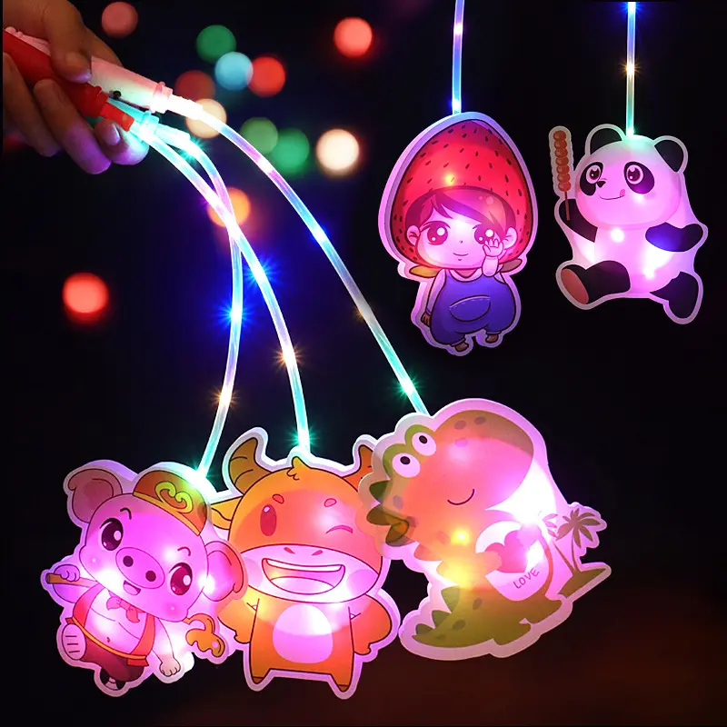 Yeni tasarım Light Up oyuncaklar el karikatür tasarım renkli LED parlayan aydınlık taşınabilir dalga topu taşınabilir fener
