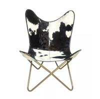 Fauteuil papillon de luxe en cuir véritable avec structure robuste et assise moelleuse pour une expérience de détente optimale dans le salon ou la chambre.