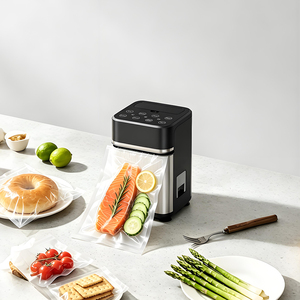Scelleuse <span class=keywords><strong>sous</strong></span> <span class=keywords><strong>vide</strong></span> compacte et élégante avec fonction autonettoyante, pour une présentation verticale des aliments sur le comptoir de cuisine moderne - Product Image 1