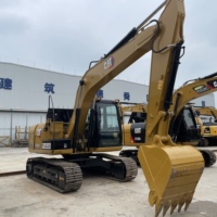 CAT 313D2GC d'occasion stable pour la construction ferroviaire et la manutention de lestage, destiné aux projets de fondation de voies et de construction de gares