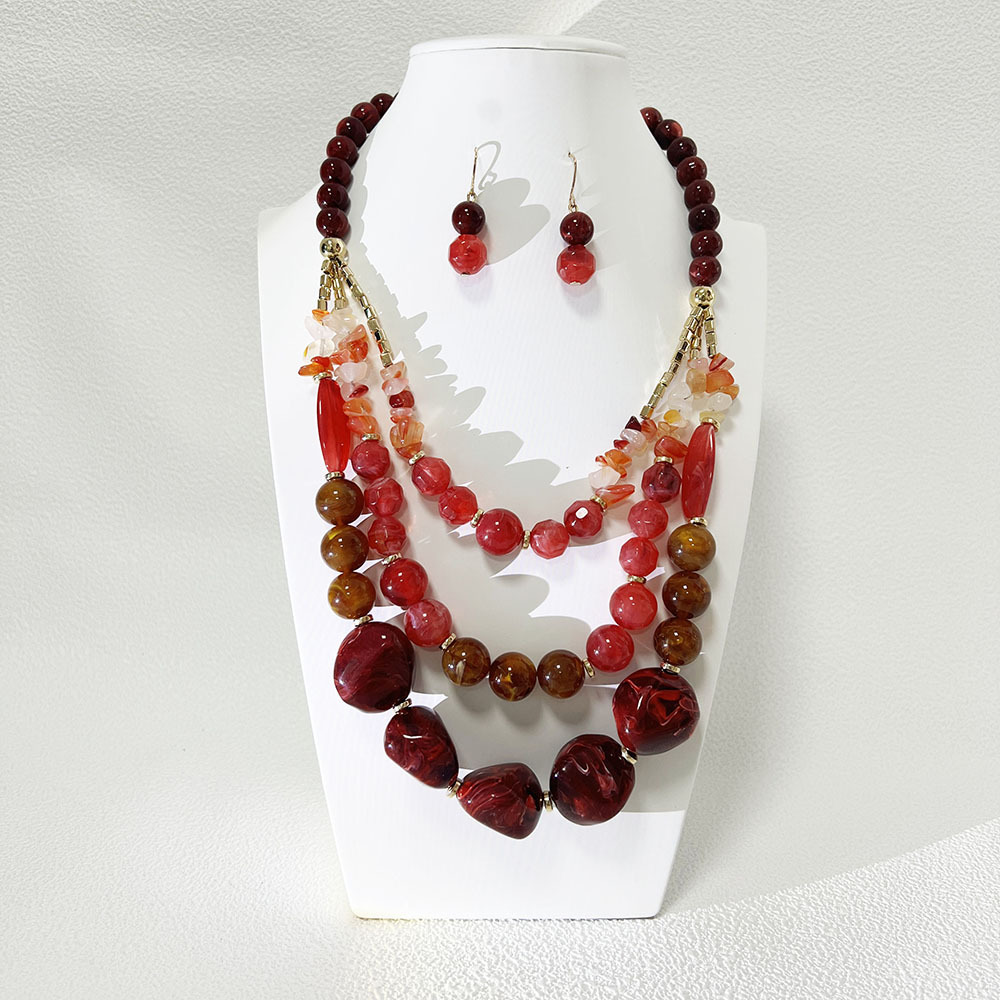 Collana e orecchini a catena in acrilico bicolore rosso