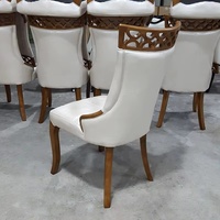 Chaise de salle à manger minimaliste faite à la main en bois massif avec siège en cuir pour la maison, le mobilier domestique et la vente en gros commerciale