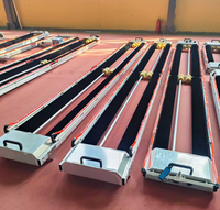 Machine de nettoyage solaire automatique de type barre avec système de rail suspendu pour les centrales solaires à grande échelle