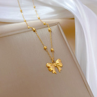 Collier en acier inoxydable plaqué or 18 carats avec pendentif nœud et chaîne perlée, forme papillon, pour femme, idéal pour les fêtes et le quotidien, vente en gros