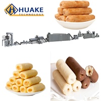 Ligne de production d'équipements d'extrusion entièrement automatiques pour la fabrication de snacks soufflés fourrés