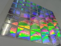 Étiquettes d'emballage anti-contrefaçon personnalisées en argent PET, holographiques fluorescentes à effet de vide, résistantes à l'huile pour téléphones mobiles et écouteurs