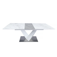 Table à manger élégante en pierre frittée extensible, gris marbre, avec pieds métalliques réglables pour salle à manger d'hôtel moderne
