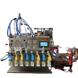 Machine de remplissage et de bouchage semi-automatique électrique haute productivité pour sachets Doypack et sachets à bec verseur pour jus - Product Image 1