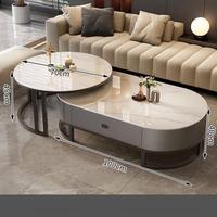 Table basse ronde ovale moderne avec structure en acier inoxydable et plateau en marbre, rangement intégré, durable, écologique, facile à nettoyer