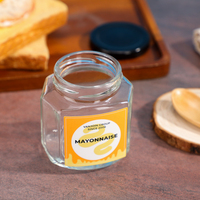 Sonderform Sechseck 180ml 6,0 Unzen Honig Oval Hex Erdnuss butter Marmelade Honig glas Gläser mit Schwarz gold Metallic Deckel
