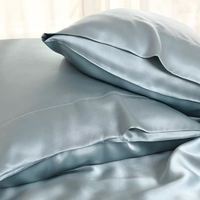 Housse de coussin décorative moderne en soie tissée 100 % personnalisée pour hôtels, avec broderie de célébrités