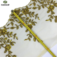 Dentelle florale dorée populaire avec broderie perlée et sequins pour robe de mariée de luxe sexy, 100 % polyester