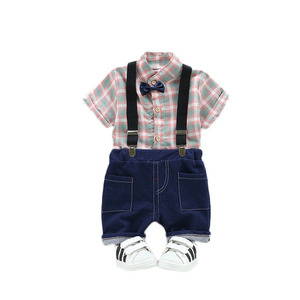 Nieuwe babykledingsets met geruite strikdas en zwart broekje met bretels - Product Image 3