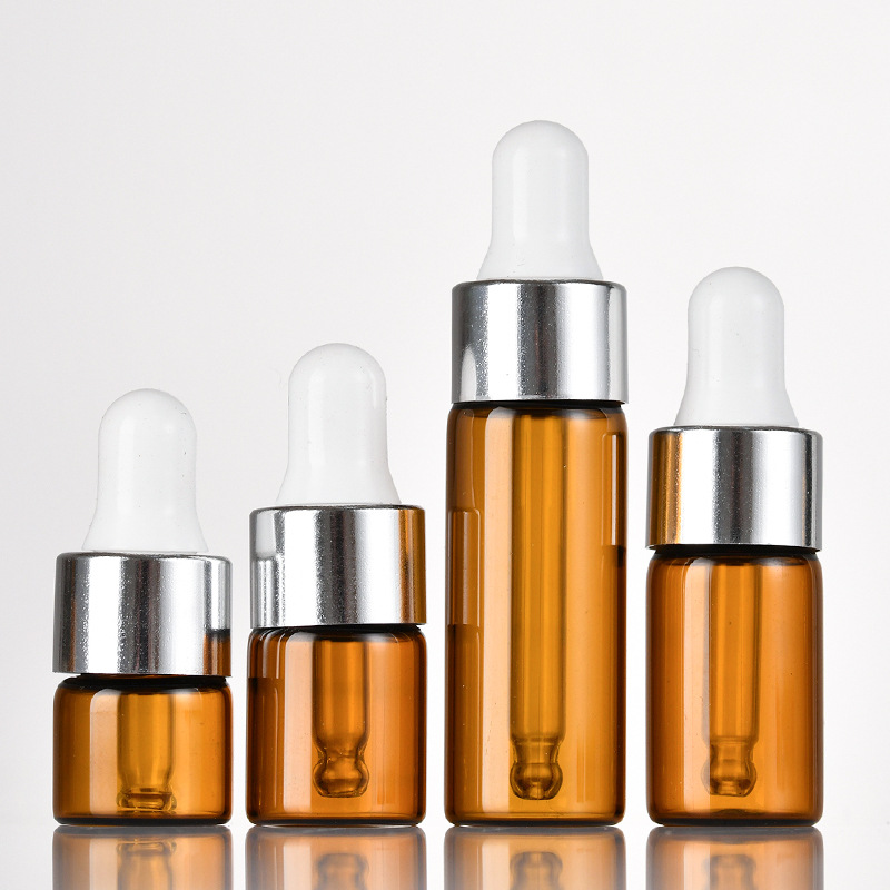 Ámbar + tapón cuentagotas plateado + tetina blanca