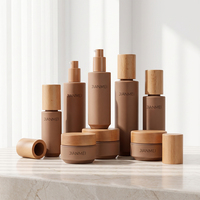 Ensemble de pots à crème pour le visage en verre kaki OEM ODM avec bouchon en bois naturel pour l'emballage cosmétique