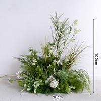 Arche de fleurs artificielles vertes tropicales pour mariage, avec support et fleurs au sol, en blanc et vert
