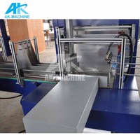 Machine d'emballage sous film rétractable entièrement automatique pour bouteilles PET, bidons d'eau, paquets multiples