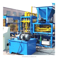Machine automatique de fabrication de blocs de pavés creux et pleins QT4-15 avec garantie d'un an, machine à briques en ciment à faible investissement