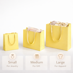 Sac shopping en papier jaune avec poignée en ruban, emballage de couleur vive pour les magasins de détail, les boutiques de cadeaux, l'utilisation de marchandises - Product Image 1