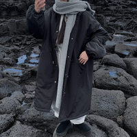Manteau long matelassé en coton pour femme, style parka chic d'hiver, coupe ample avec cordon de serrage et col montant, chaud et douillet