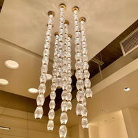 Lustre en cristal LED de luxe pour plafonds hauts, villas et longues escaliers avec douille E12