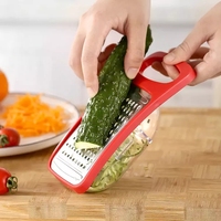 Râpe manuelle multifonctionnelle en acier inoxydable pour fromage, fruits et légumes avec récipient et poignée en PP