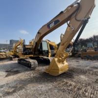 Excavatrice hydraulique CAT 320E d'occasion, fonctionnement fluide, largement utilisée dans la rénovation urbaine et l'aménagement paysager