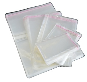 Vente en gros <span class=keywords><strong>pas</strong></span> <span class=keywords><strong>cher</strong></span> joint auto-adhésif transparent vêtements Opp emballage <span class=keywords><strong>sac</strong></span> en plastique rouleau comestible sacs-cadeaux - Product Image 2