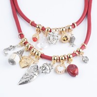 Collier vintage multicouche en cuir pour femme, avec pendentifs multiples (cœur, feuille, perle, strass), bijou de mode affirmé