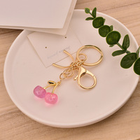 OEM Tascharms Roze Kersen Fruit 18K Goud Gegalvaniseerd Vlinderstrik Accessoire Vlekvrij Waterdicht Esthetische Mode Sieraden Cadeau