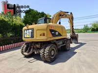 Excavatrice sur pneus d'occasion Caterpillar M315D M312 M317D2 en stock / Machine de terrassement sur roues Cat America originale à vendre