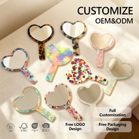 Miroir de poche compact personnalisé en acétate en forme de cœur avec logo, idéal pour les boutiques, la vente au détail et les coffrets cadeaux