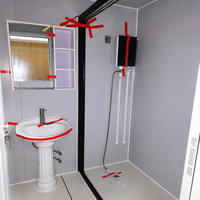 Maison conteneur pliable haut de gamme moderne avec cuisine extérieure intégrée, salle de douche, buanderie et bureau, servant de bâtiment de bureaux