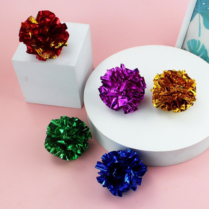 Bolas de papel chirriantes de colores
