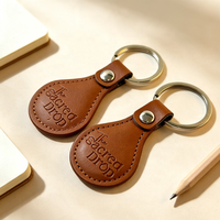 Porte-clés en cuir PU personnalisé avec logo en relief de haute qualité, en gros, pour la promotion d'entreprise et les souvenirs de salons professionnels