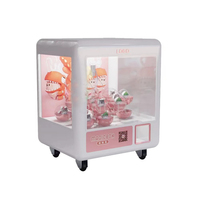 2025 Usine Directe Mini Poupée Machine À Monnaie Multi-Fonction Boîte Magique Griffe Clip Jouet et Bonbons Cadeau Griffe Machine