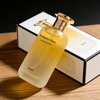 Vente en gros de flacons de parfum en verre transparent cylindriques personnalisés de 50 ml, 70 ml, 100 ml avec atomiseur et pompe