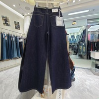 Nouvelle collection automne 2026 – Pantalon large décontracté et chic pour femme, bleu foncé délavé, avec détails boutonnés cloutés, taille haute, coupe ample, idéal au quotidien.