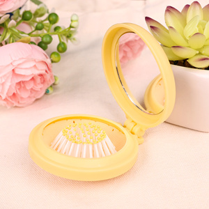 Espejo de Maquillaje de Mano Mini, Doble Cara, de Plástico Ecológico, con Peine, con Logotipo Impreso en UV Personalizado - Product Image 1