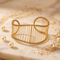 Bracelet large ajouré tressé haut de gamme, style français, minimaliste, luxueux, en acier inoxydable plaqué or, jonc ouvert polyvalent