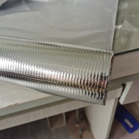Isolation réfléchissante multicouche en feuille d'aluminium/MPET renforcée avec fibre de verre/PE, feuille de maille rélaminée
