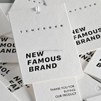 Vêtement de luxe Étiquette volante personnalisée Logo en relief Vêtements en papier blanc mat