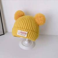 Vente en gros usine Nouveauté 2026 Automne Hiver Bonnet tricoté pour enfants avec cache-oreilles, doublé polaire, mignon et chaud pour bébés et nourrissons, pour l'extérieur