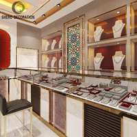 Vitrine d'îlot en métal haut de gamme pour bijouterie, avec verre incurvé et éclairage LED, pour magasin d'or, design personnalisé