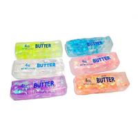 Nouveau produit le plus vendu : Jouet anti-stress en forme de bâton de beurre ou de vaseline, en caoutchouc souple et coloré, avec ruban et forme de dessin animé amusante