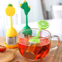 Infuseur de boule de thé d'acier inoxydable de poignée de silicone de forme de fruit avec la soucoupe