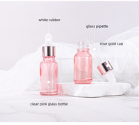 En stock flacon en verre de 5ml 10ml 15ml 20ml 30ml 50ml 100ml compte-gouttes en verre cosmétique rose avec bouchon en or