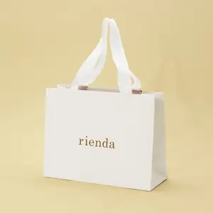 Custom Logo Printed Luxury Cardboard Tote Packaging Art Clothes Gift Shopping Paper Bags Crafted Bagged Presentation