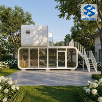 Villa préfabriquée de luxe à deux étages avec terrasse, entièrement équipée, structure en acier, maison modulaire moderne de style Apple